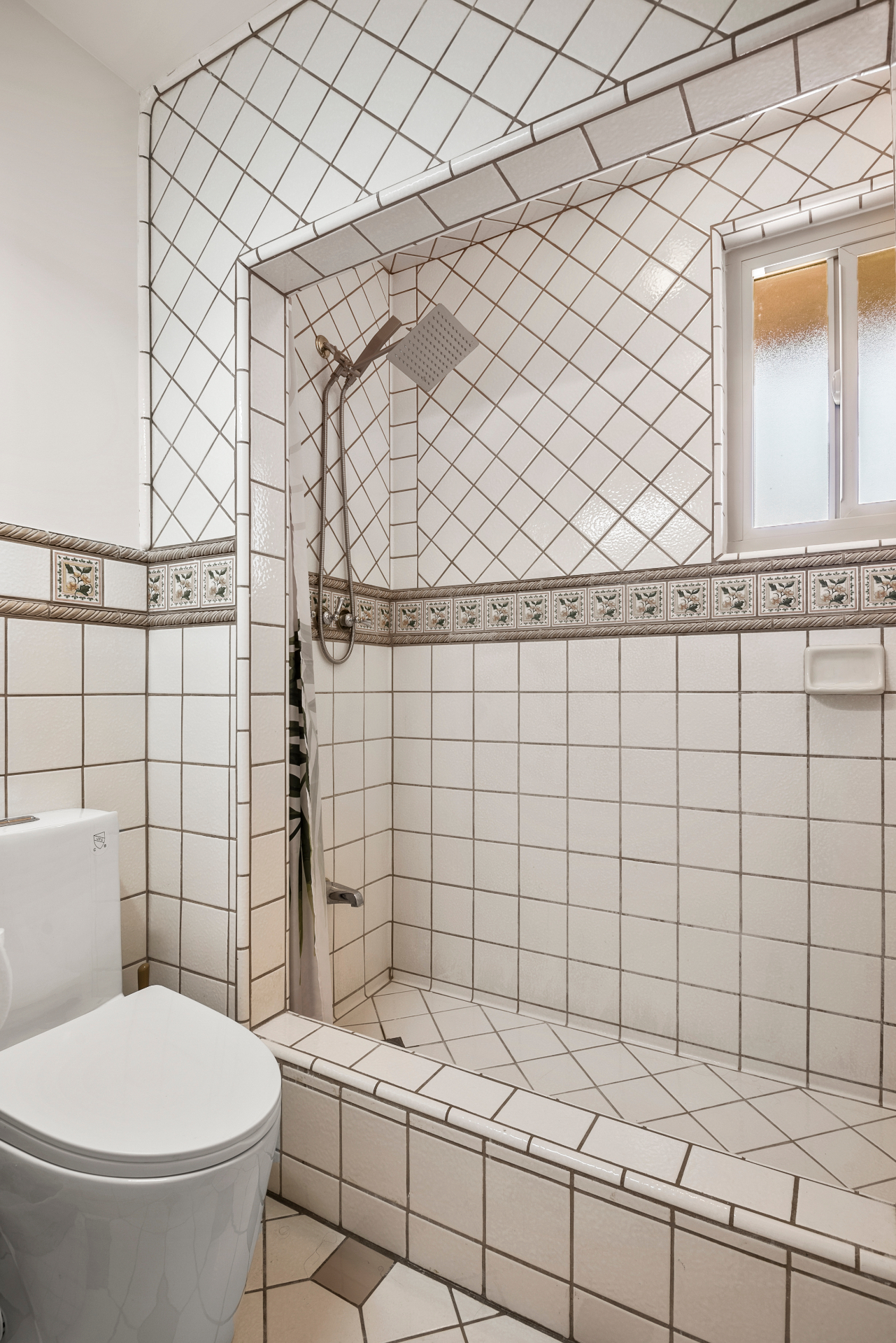 Bathroom 2 (shared) — shower and tile detail